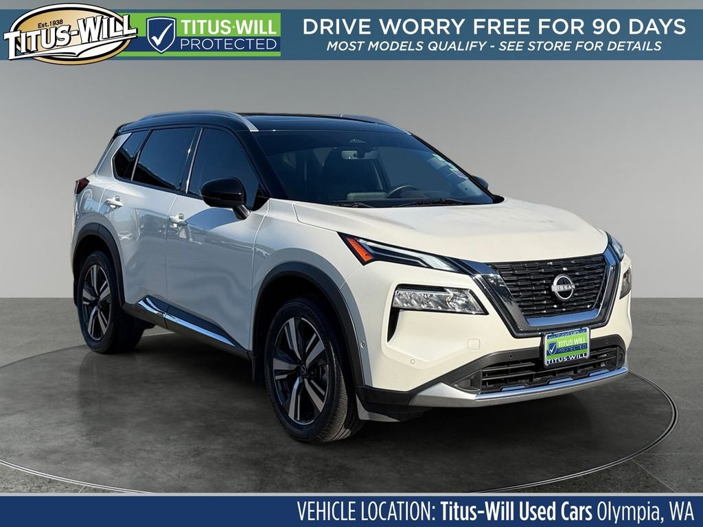 2023 Nissan Rogue Platinum in Pearl White Tricoat/Super Black — front three-quarter view