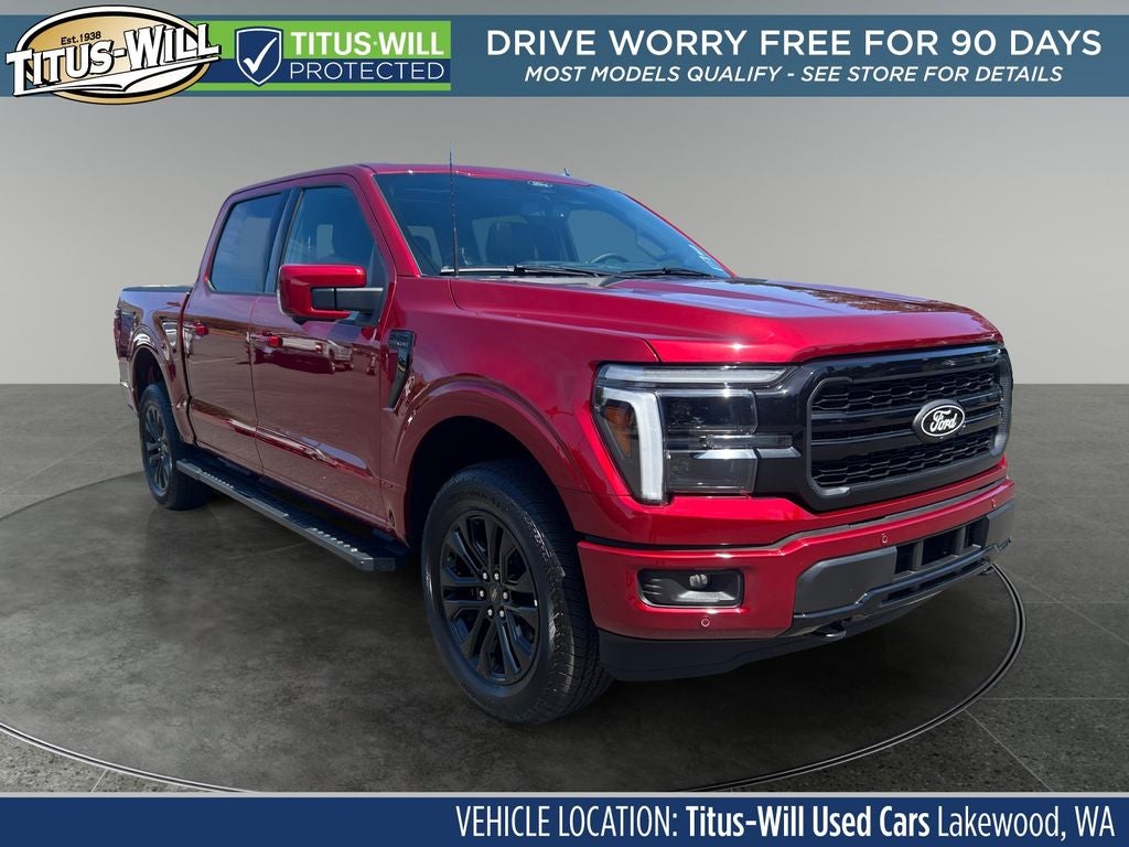 2026 Ford F-150 Lariat in Ruby Red — front three-quarter view