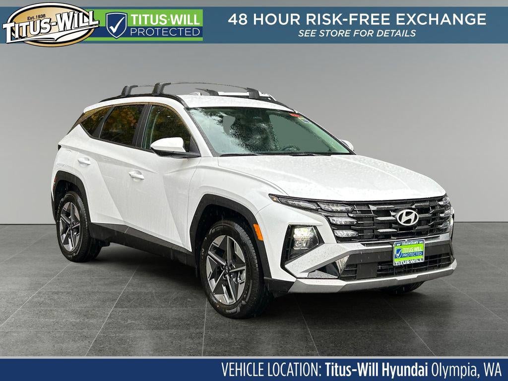2026 Hyundai TUCSON PLUG-IN HYBRID SEL in Creamy White Pearl — front three-quarter view