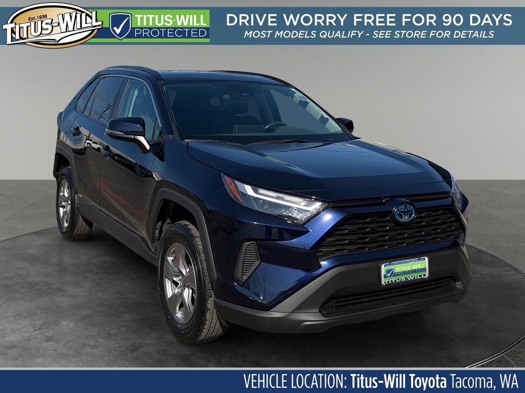 2024 Toyota RAV4 Hybrid XLE in Dk. Blue Mc. — front three-quarter view